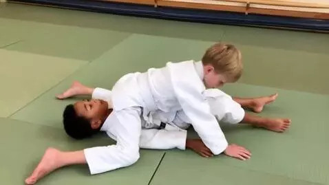 AI Video from prompt: two boys at six years,wearing white judo jackets