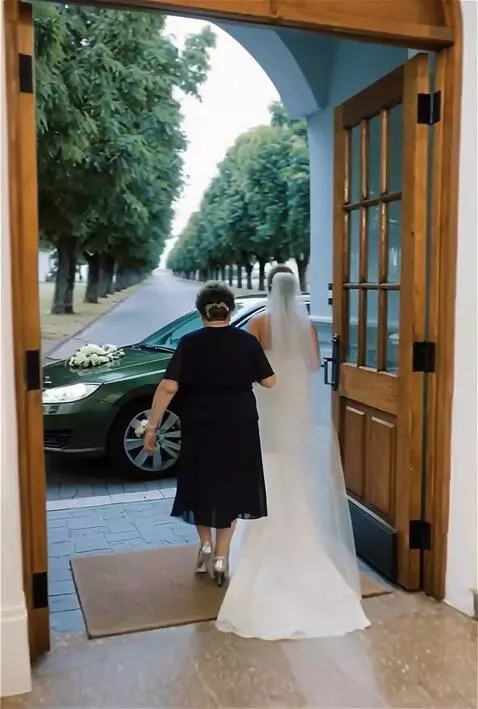 AI Video from prompt: After leaving the building, the newlyweds find t