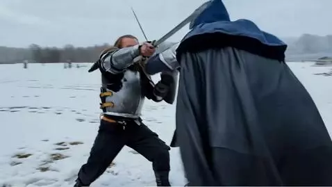 AI Video from prompt: Two men sword fight in the snow. The camera sirk
