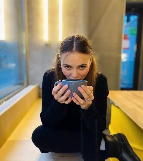 AI Video from prompt: he brings the cup to his mouth