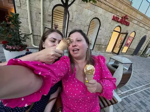 AI Video from prompt: The girl on the left puts her hand into her mout