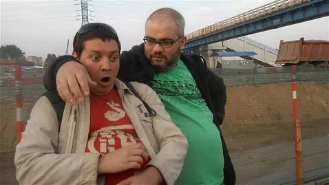 AI Video from prompt: The fat guy on the left suddenly started to grow