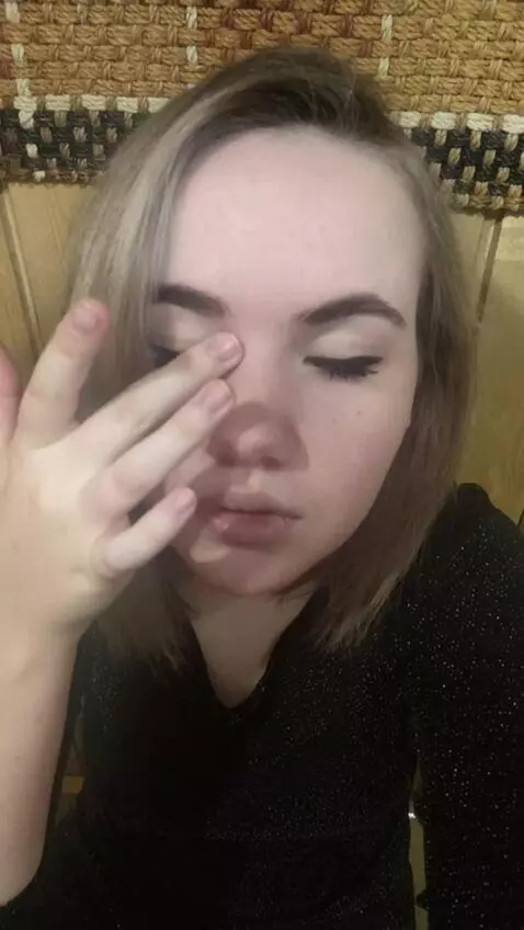 AI Video from prompt: The girl smears transparent honey on her upper e