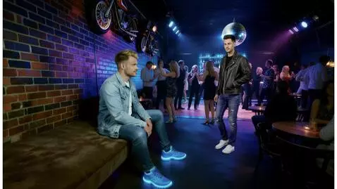 AI Video from prompt: A man in a denim jacket and blue sneakers turns 