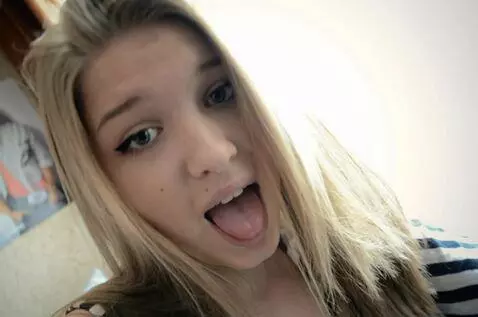 AI Video from prompt: The woman smiles shyly as she approaches the cam