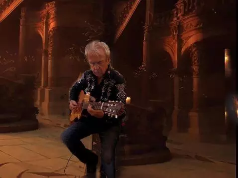AI Video from prompt: The Guitarist plays the intro guitar, the candle