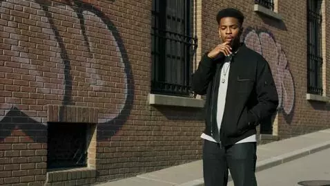 AI Video from prompt: That guy is going to all the sudden start rappin