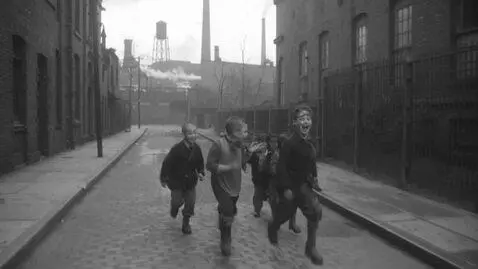 AI Video from prompt: The children run happily down the street, while 