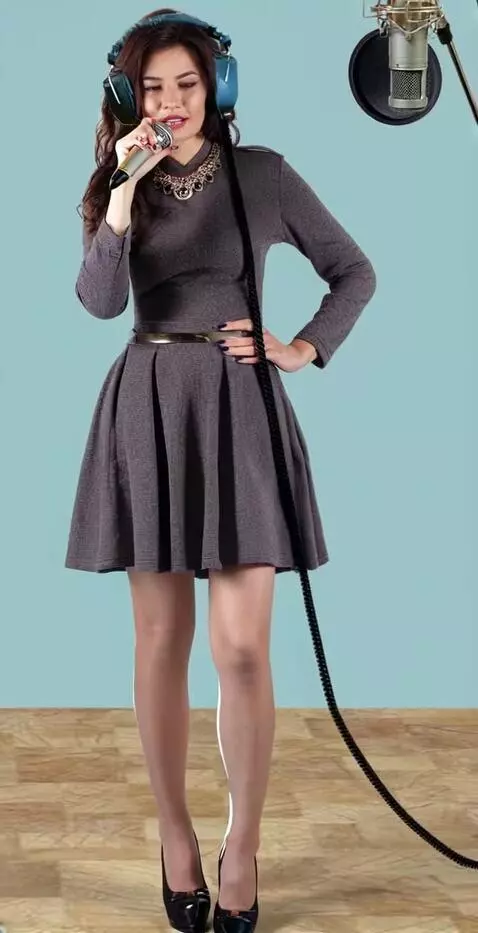 AI Video from prompt: a young woman in a recording studio. They put a 