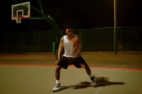 AI Video from prompt: A guy is alone on a basketball court, but he’s a