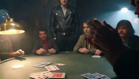 AI Video from prompt: A gritty, neon-lit poker game in a smoky undergr