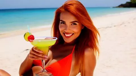 AI Video from prompt: A beautiful woman with long, wavy copper hair an