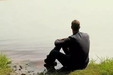AI Video from prompt: man siting near river