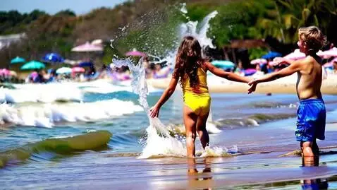 AI Video from prompt: 12 year girl and boy in beach playing with water