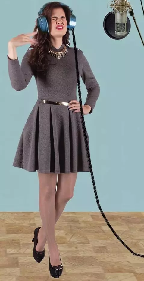 AI Video from prompt: a young woman in a recording studio. They put a 
