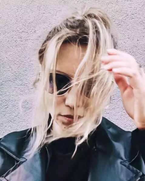 AI Video from prompt: Make her hair moving and do smth interesting wit