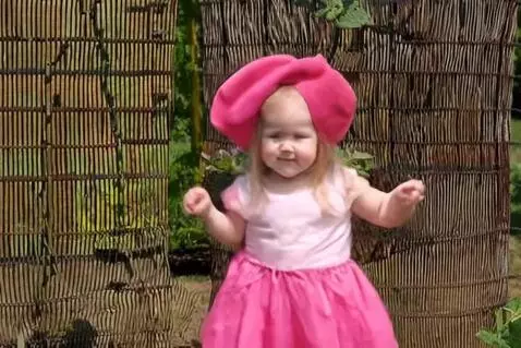 AI Video from prompt: A baby girl in a potato costume dances in the ga
