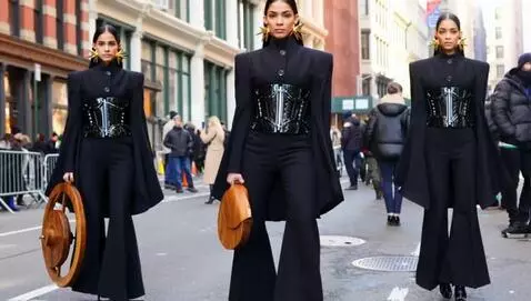 AI Video from prompt: three fashion models walking down the road in Ne