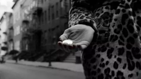 AI Video from prompt: An extreme close up of a woman's graceful hand w