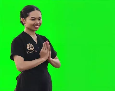 AI Video from prompt: The Thai girl bows slowly and carefully with her