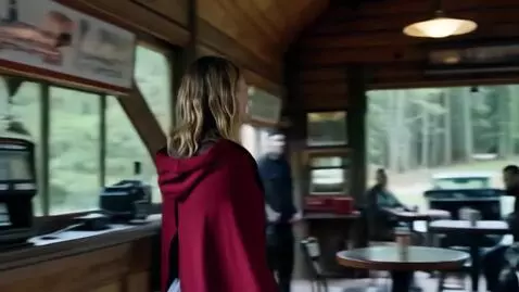 AI Video from prompt: A young blonde woman with slightly damp, shoulde