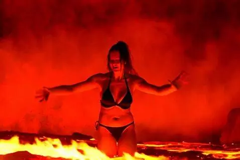 AI Video from prompt: A beautiful woman in a black bikini falls from a