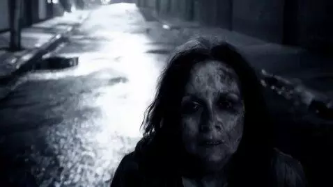 AI Video from prompt: Make a creep video of a homeless dirty woman tur