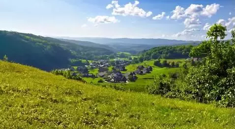 AI Video from prompt: Photorealistic view from a high hill on a clear 