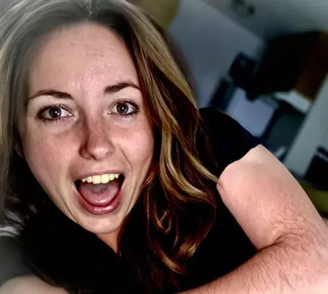 AI Video from prompt: A woman lies on her back and sticks out her tong