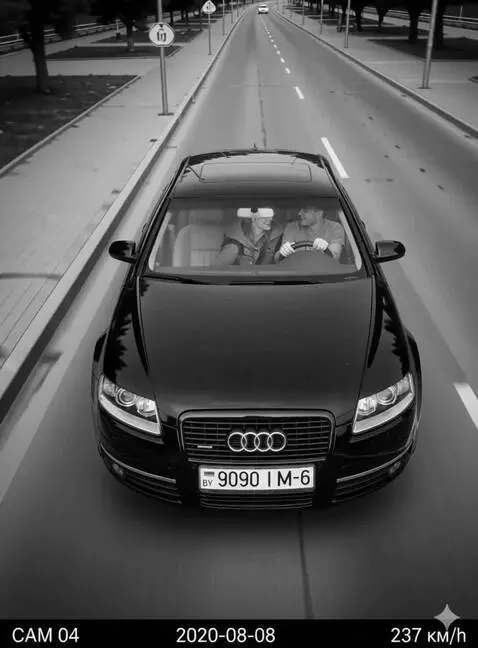 AI Video from prompt: A happy young couple is just driving along the h