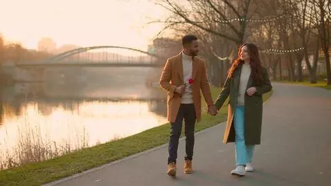 AI Video from prompt: a couple walking on river and proposing with a r