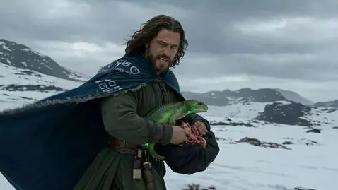 AI Video from prompt: "A wizard in a blizzard holds a lizard and a giz