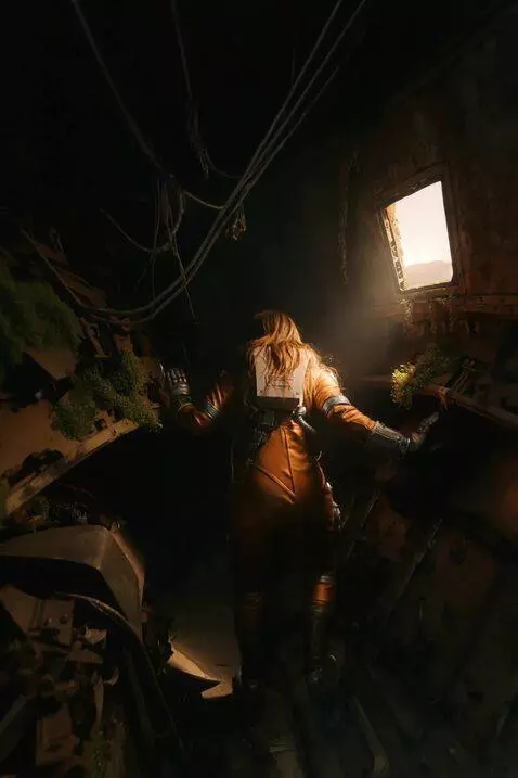 AI Video from prompt: A woman in an orange spacesuit slowly and carefu