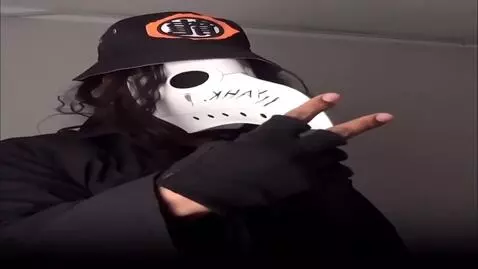 AI Video from prompt: The character holds up two of his fingers in ges