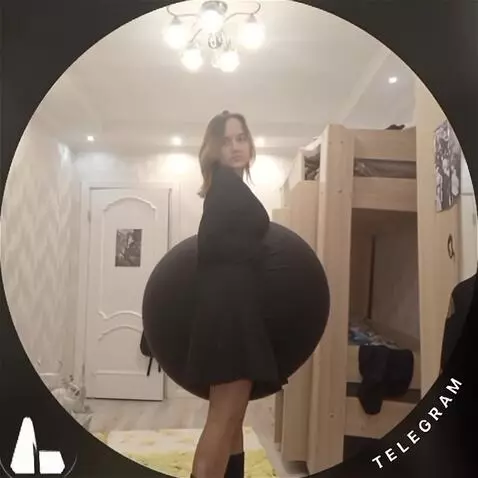 AI Video from prompt: The girl's belly fills with water, becoming larg