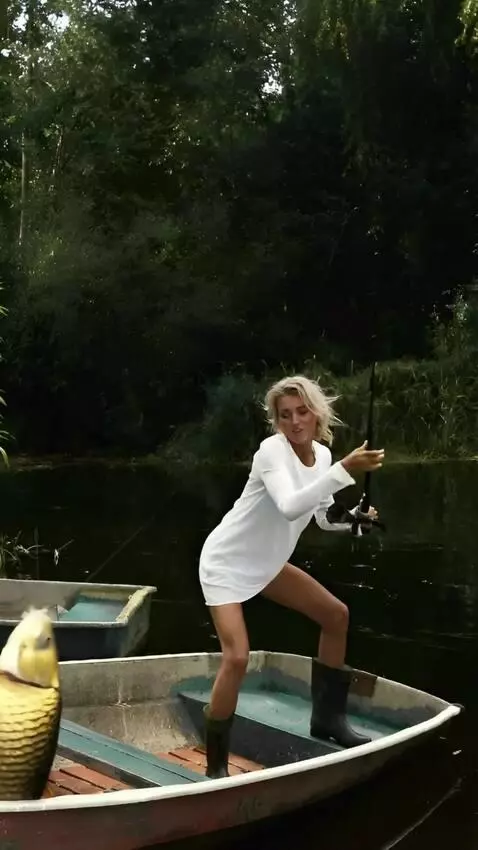 AI Video from prompt: the girl puts her feet in the boat and pulls a l