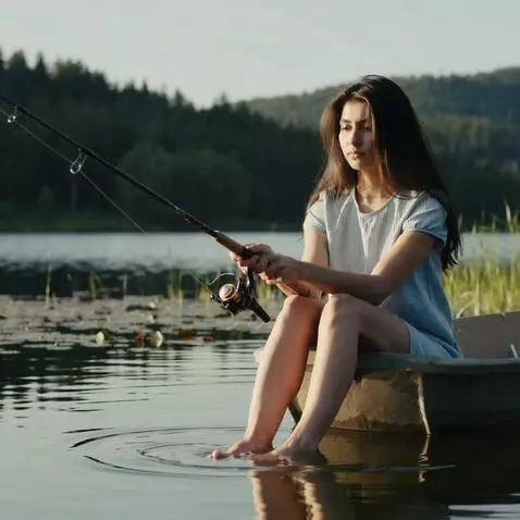 AI Video from prompt: A girl in a short skirt rests her feet in the bo