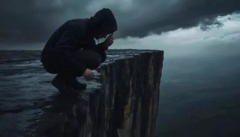 AI Video from prompt: Rain, guy looks down, saying a prayer