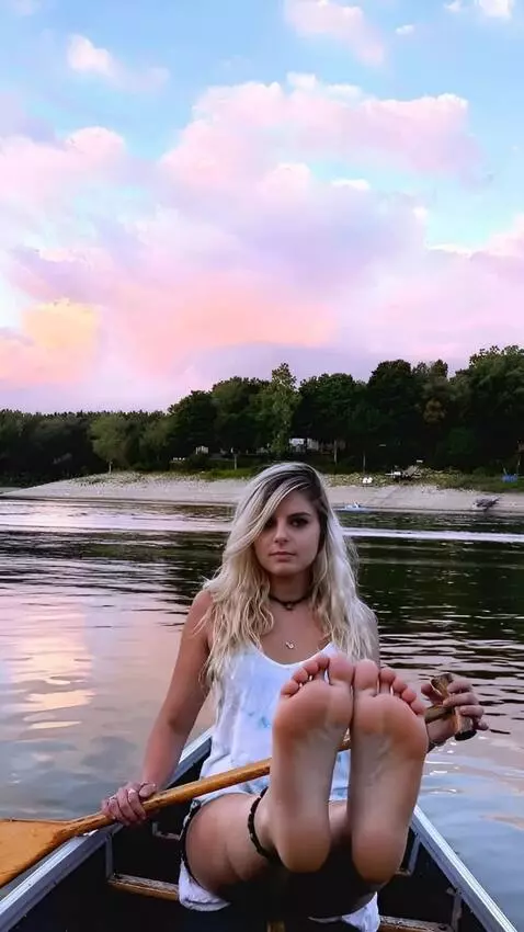 AI Video from prompt: A girl in a short skirt puts her feet up and cas