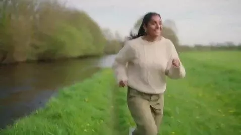 AI Video from prompt: a beautiful british indian girl with charming sm