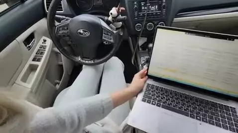 AI Video from prompt: First-person view. Action: moves the laptop to t