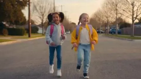 AI Video from prompt: littles in pigtails running down the street.