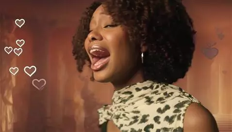 AI Video from prompt: camera pans to the right focusing on the girl, s