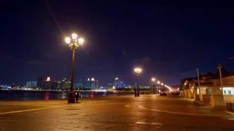 AI Video from prompt: I'm walking around the city and it's night and t
