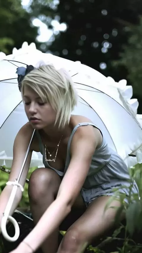 AI Video from prompt: girl is squatting in a skirt  takes a large  gol