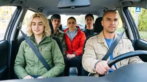 AI Video from prompt: People in the photo are driving in a car through