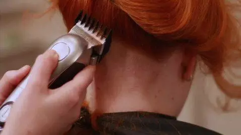 AI Video from prompt: A young woman with very thick, dense, fiery red-