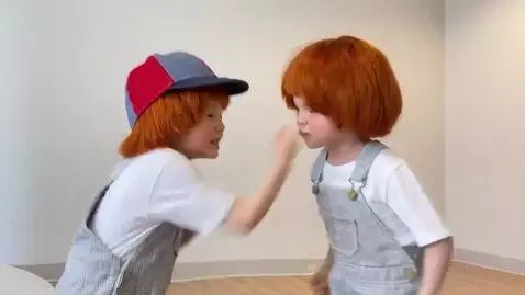 AI Video from prompt: two boys with ginger hair,angry fight,pinching t