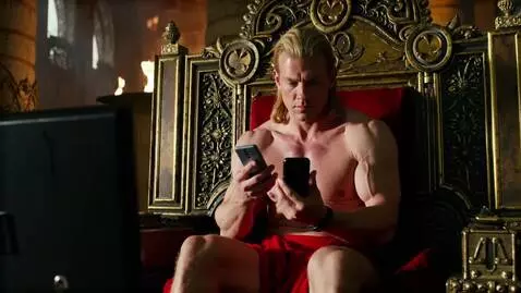 AI Video from prompt: AI Video of strong man (He-Man-style look) is si