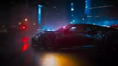 AI Video from prompt: On a city street at night, a police car pursues 